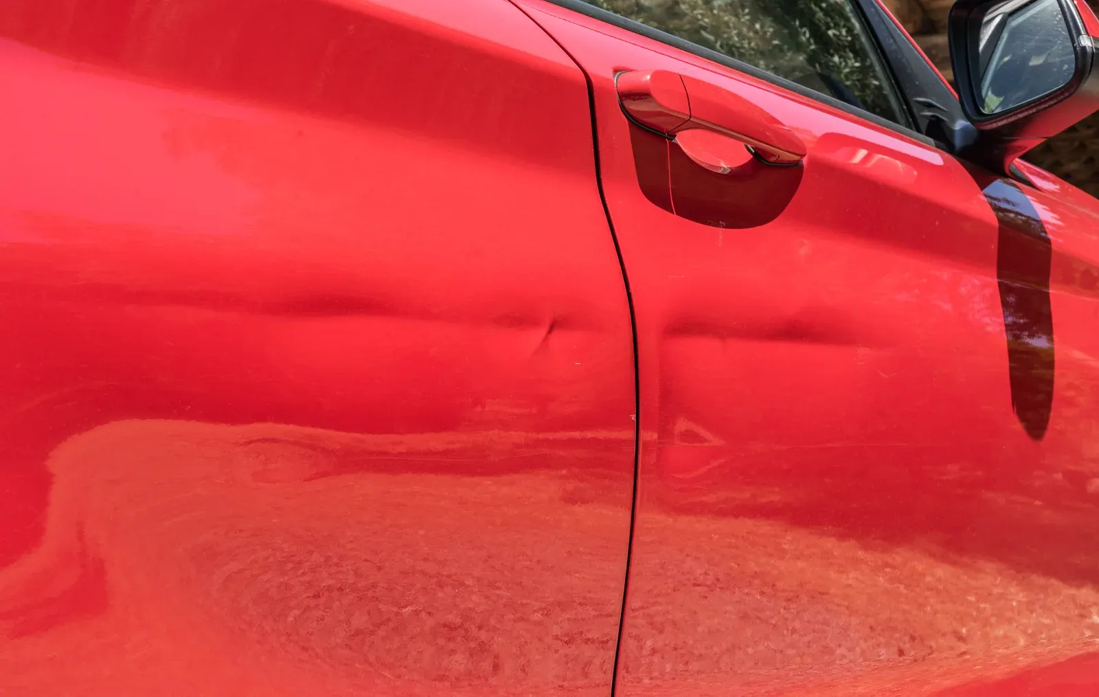 Before: door & quarter panel dents